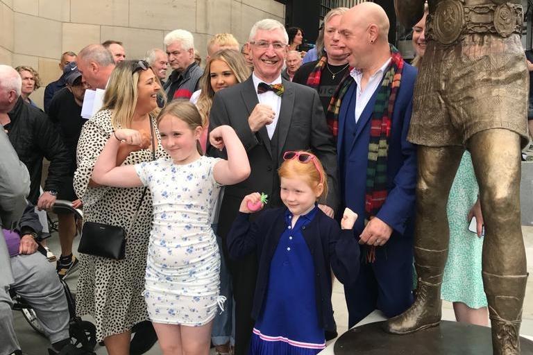 Ken with members of his family at the unveiling of his statue last August.