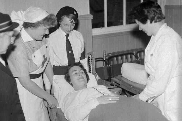 Mrs R Howell gives blood in a mobile unit of Blood Transfusion Service at Musselburgh Town Hall in July 1965.