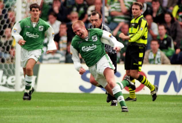 Chic Charnley wheels away in delight after netting the winner for Hibs