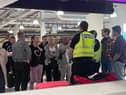 Police were seen at Edinburgh Airport's baggage reclaim area trying to manage the situation.