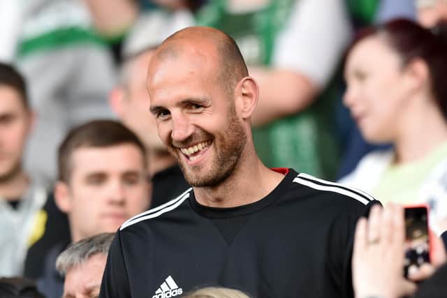 All smiles from former Hibs captain Rob Jones as he takes his seat amongst the away fans for the Premiership play-off match against Hamilton in 2014. Pic: SNS Group Craig Williamson