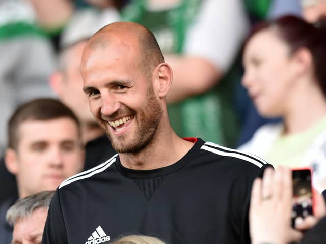 All smiles from former Hibs captain Rob Jones as he takes his seat amongst the away fans for the Premiership play-off match against Hamilton in 2014. Pic: SNS Group Craig Williamson