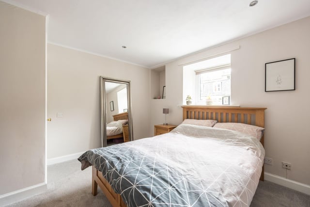 The property's spacious double bedroom comes with a fitted cupboard.