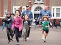 New Zealand rugby stars Tupou Vaa'i & Ethan de Groot pictured with the pupils from Leith Primary School on their Daily Mile.