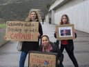 "Mikaela Loach (front) alongside two other climate activists outside the Scottish Parliament in Edinburgh. "