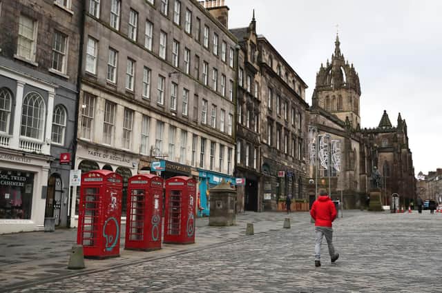 Edinburgh's Royal Mile was almost deserted the morning after stricter lockdown measures came into force for mainland Scotland in January (Picture: Andrew Milligan/PA)