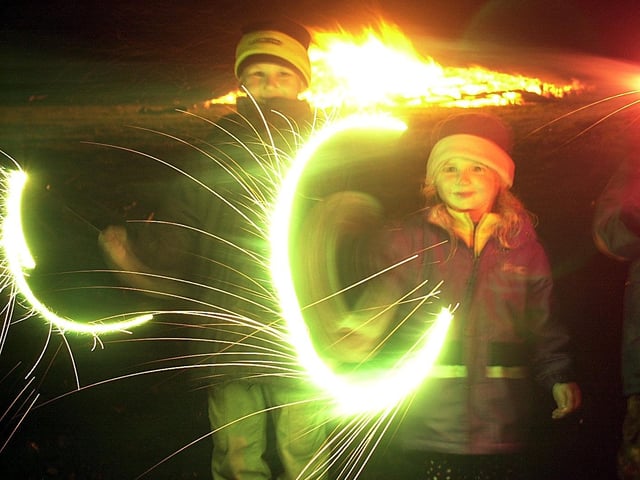 Bonfire Night at George park in Currie, 2001. Kieran Davies, 7, and his sister Lauren, 5, play with sparklers.