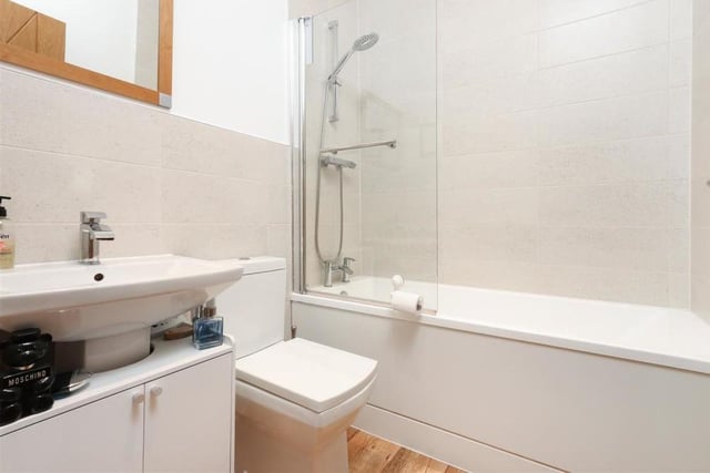 Before we take a look at the bedrooms, here is the family bathroom. It comes complete with bath and overhead shower, low-flush WC, wash hand basin and cupboard unit.