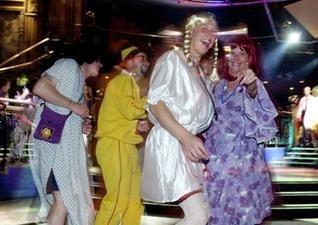 Stag-party revellers dance at the Revolution on Lothian Road, June 29, 2001. Is that Ali G dancing with Agnetha and Frida from ABBA? Revolution is no longer a nightclub and has since been transformed into Wetherspoon gastro pub Caley Picture House.