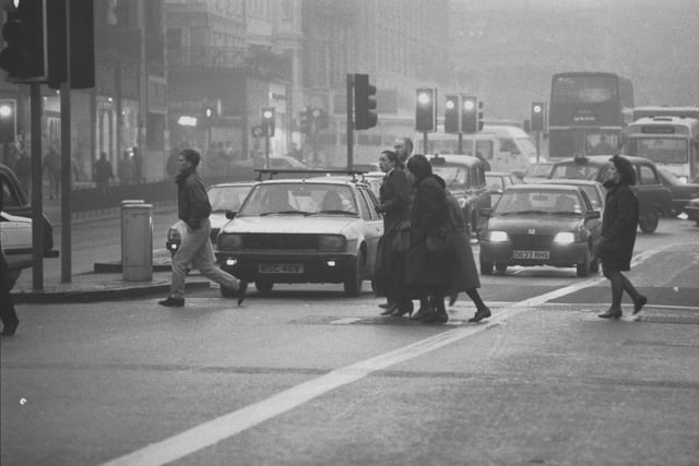 Fog causes problems for cars and pedestrians in Edinburgh's Lothian Road in December 1989.