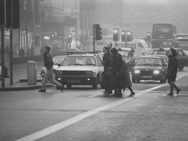 Fog causes problems for cars and pedestrians in Edinburgh's Lothian Road in December 1989.