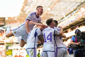 Scotland players celebrate with goalscorer Lyndon Dykes after the equaliser against Norway in Oslo on Saturday. Picture: Getty