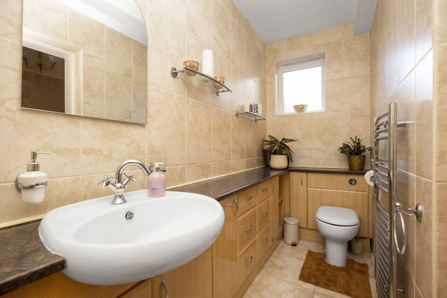 The property has a stylish and spacious downstairs toilet.