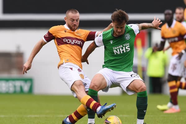 Motherwell's Allan Campbell (left) tackles Hibernian's Melker Hallberg during the Scottish Premiership match at Easter Road on August 15. (Ross MacDonald / SNS Group)