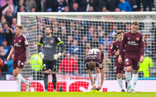 The dejected Hearts players look on during the 2-0 defeat by Rangers at Hampden.