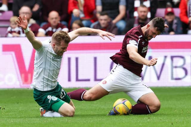 Cadden challenges Hearts' Craig Halkett during the derby encounter
