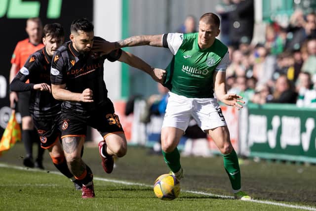 Clarke tries to give Dundee United striker Tony Watt the slip during the 1-1 draw