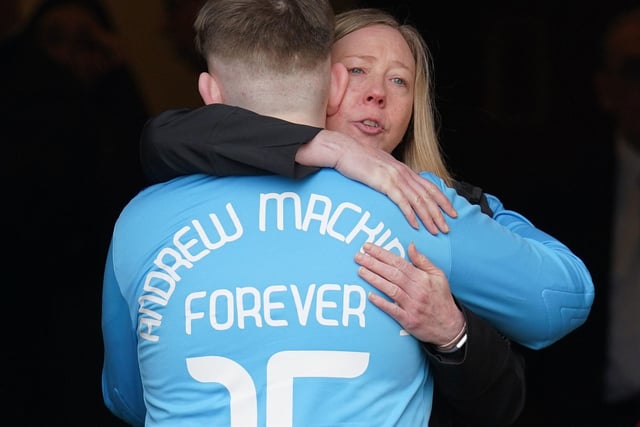 Mourners comfort each other at the funeral on Friday. Andrew, who played for Salvesen Community Football Club was a massive Hearts fan.
Photo: Andrew Milligan PA Wire