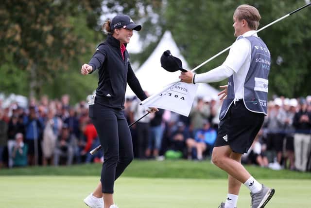 Linn Grant celebrates on the 18th green after holing the winning putt with her boyfriend and caddie Pontus Samuelsson. Picture: Naomi Baker/Getty Images.