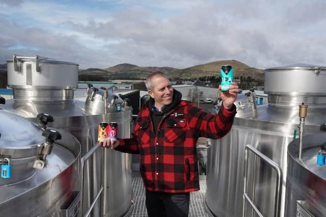 Steve Stewart, owner of Stewart Brewing, shows off the new range atop the brewery’s beer tanks looking out to the Pentlands.