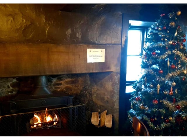 The fire may have been lit - but there wasn't a customer in sight at the Cramond Inn on Christmas Day.