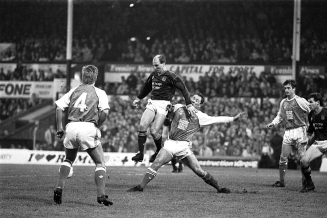 Hearts' Eamonn Bannon beats Hibs' Gordon Rae in the traditional New Year's Day Hearts v Hibs Edinburgh derby football match played at Tynecastle in January 1990. Final score 2-0 to Hearts.