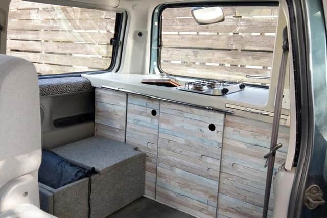 The interior of the van with bed folded away.