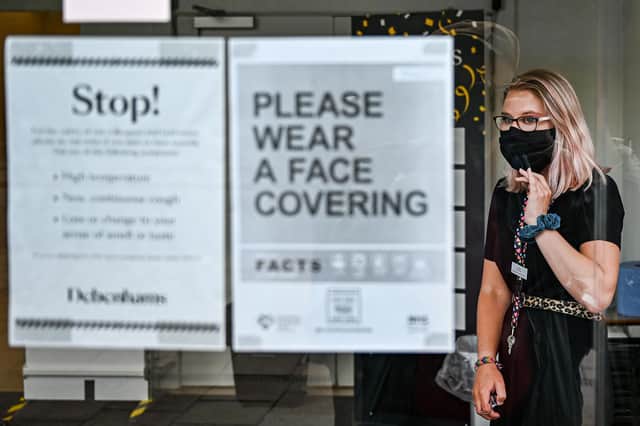 A shopper in Princes Street wears a mask. Susan Morrison will keep wearing hers for the good of all, she says. Photo by Jeff J Mitchell/Getty Images