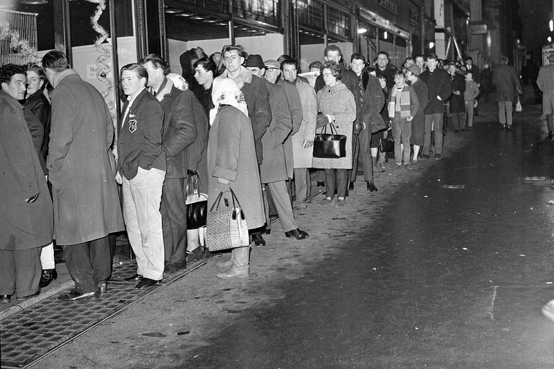 People queue outtside Mackenzie's sport shop in Nicolson Street for tickets to the Hearts v Hibs Edinburgh Derby match to be played at Tynecastle on New Year's day 1965.