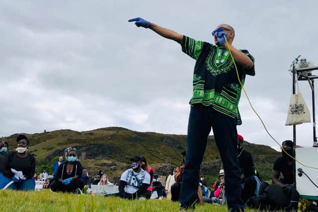 Joseph Malik, Edinburgh musician, addresses the crowds in Holyrood Park