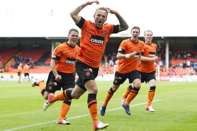 Johnny Russell leads the celebrations after giving Dundee United an early lead in this opening-day encounter at Tannadice.