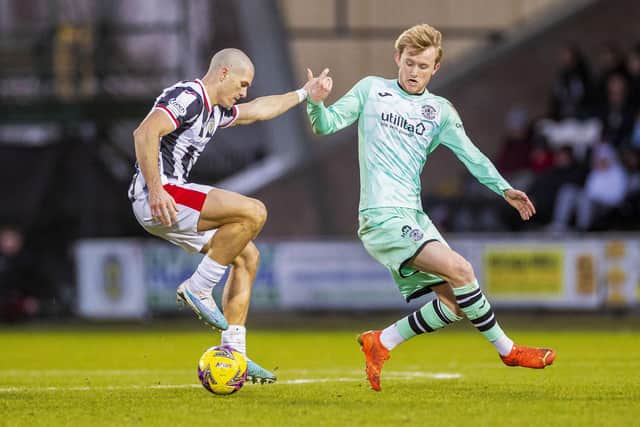 Henderson vies with former Hibee Alex Gogic during the 1-0 win in Paisley