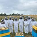 The Amazon team with the bee hives