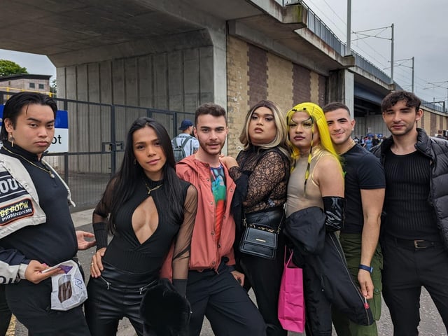 A group of fashionably dressed fans posed for a picture as they excitedly waited for the Beyoncé concert.