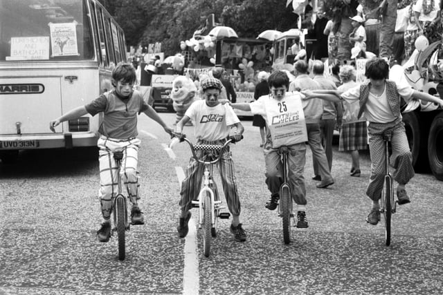 Boys on bicycle and unicycles take part in the Evening News sponsored Edinburgh Festival Cavalcade in August 1985