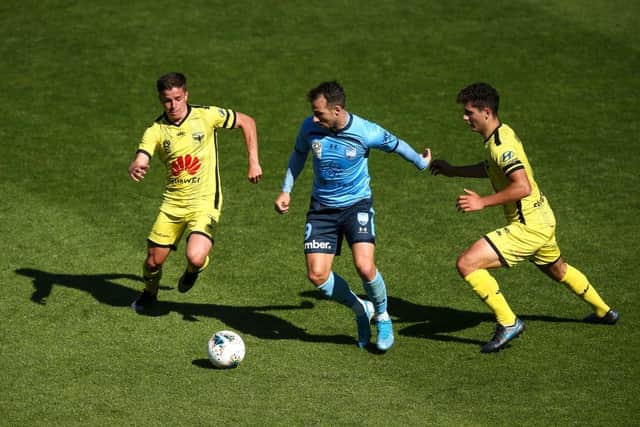 Adam Le Fondre being tackled by Cameron Devlin during a Syndey FC and Wellington Phoenix fixture in the A-League in 2019. Picture: Getty