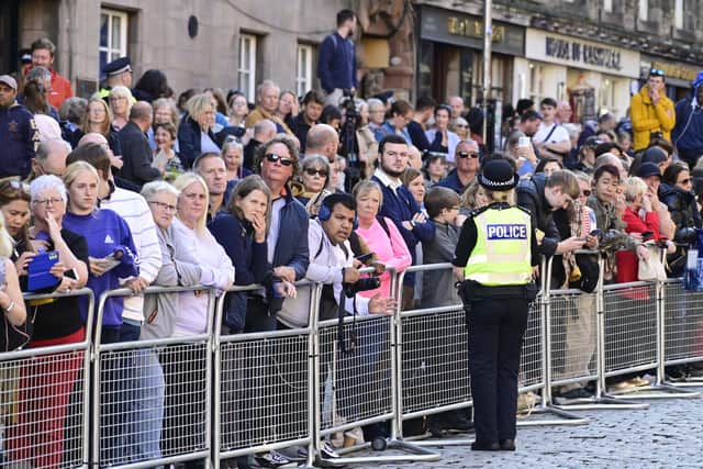 Thousands of people lined the Royal Mile for the procession from the Palace of Holyroodhouse to St Giles' Cathedral after the death of Elizabeth II. Picture: John Devlin.