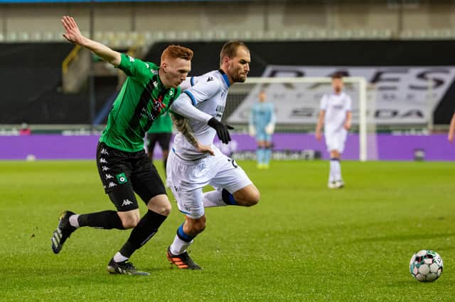 Cercle Brugge's David Bates battles for the ball with Bas Dost of Club Brugge during the Bruges derby in January 2021