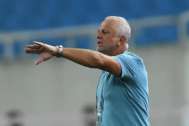 Australia's coach Graham Arnold gestures during September's World Cup qualifier against Vietnam. (Photo by MANAN VATSYAYANA/AFP via Getty Images)