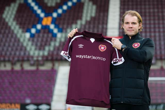 Hearts manager Robbie Neilson with the "new" sponsor.
