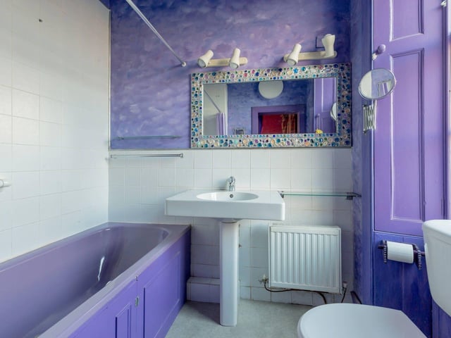 The colourful en-suite bathroom off the main bedroom.