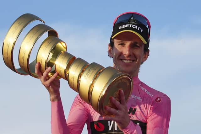 Britain's Simon Yates holds the trophy after winning the Giro d'Italia cycling race, in Rome, Sunday, June 1, 2025. (Gian Mattia D'Alberto/LaPresse via AP)