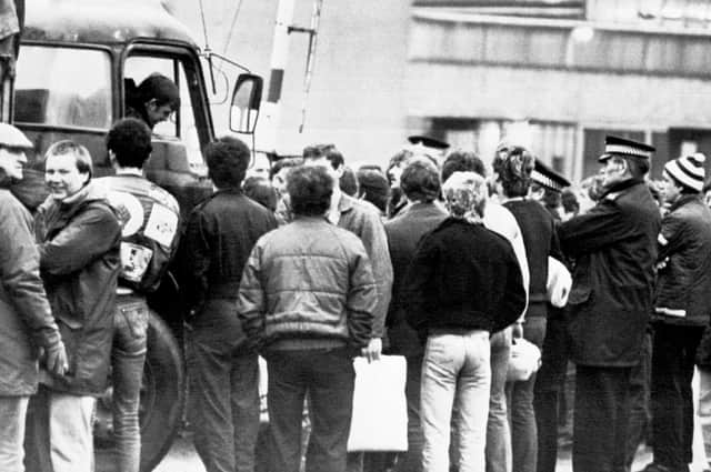 Police look on as picketers speak to a lorry driver at Bilston Glen early in the strike (Picture: PA)