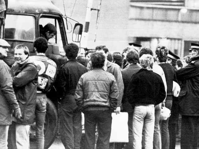 Police look on as picketers speak to a lorry driver at Bilston Glen early in the strike (Picture: PA)