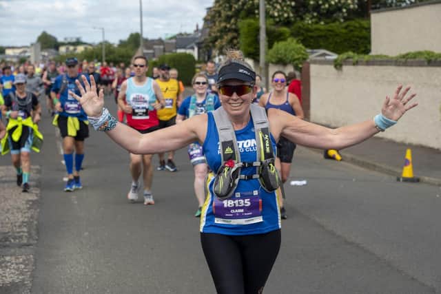 Runners in the Edinburgh full Marathon run through the four mile mark in the Craigentinny area of the City on Sunday morning.