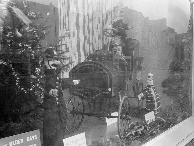 The Music Hall, on George Street, had an interesting window display with Punch and Judy figures and a mechanical train. This photo was taken just before Christmas in 1962.