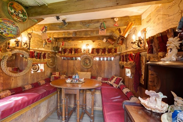 Nestled in the garden is an impressive wooden pirate ship, which is ideal for a children’s play area and boasts inside seating with ornate wooden decor.