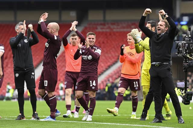 Hearts players and coaches celebrate at full-time on Saturday.