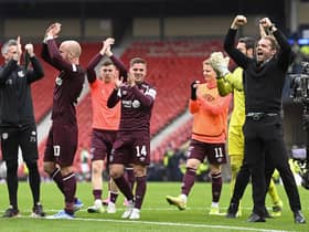 Hearts players and coaches celebrate at full-time on Saturday.