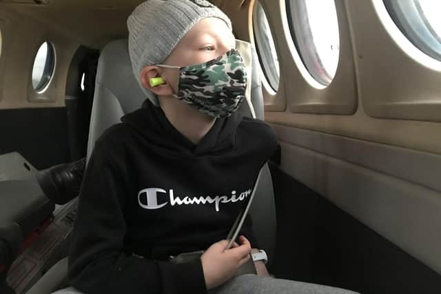 Leo in an air ambulance, flying to Birmingham for his liver transplant.